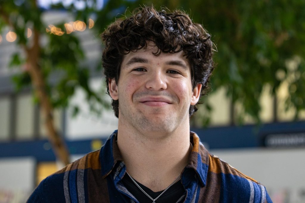 A student poses for a photo