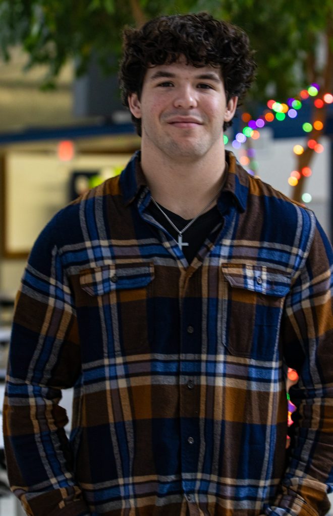 A student poses for a photo