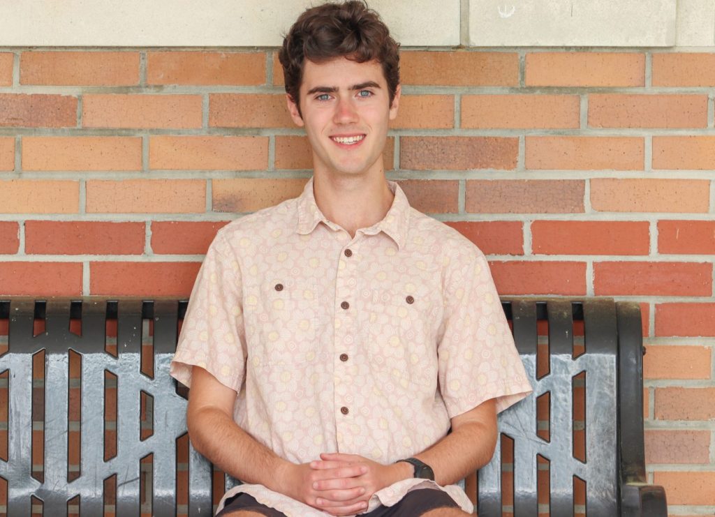A student poses for a photo